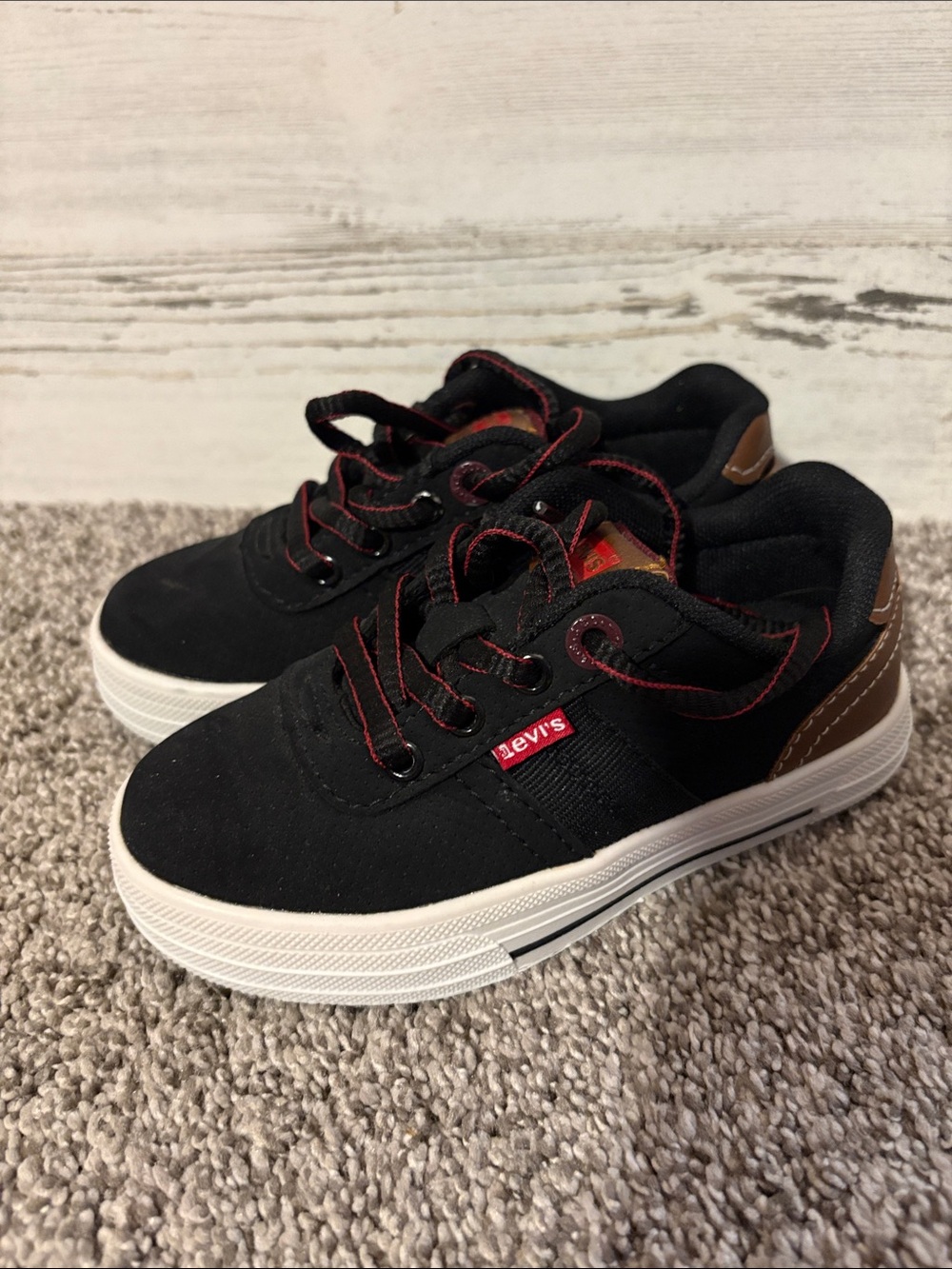 Levi's Black Canvas Kids Sneakers with Brown Heel and Red Stitching